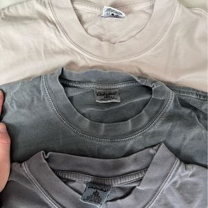 Three (3) Cabela’s men’s t-shirts, size L. Tan, faded blue indigo, faded gray